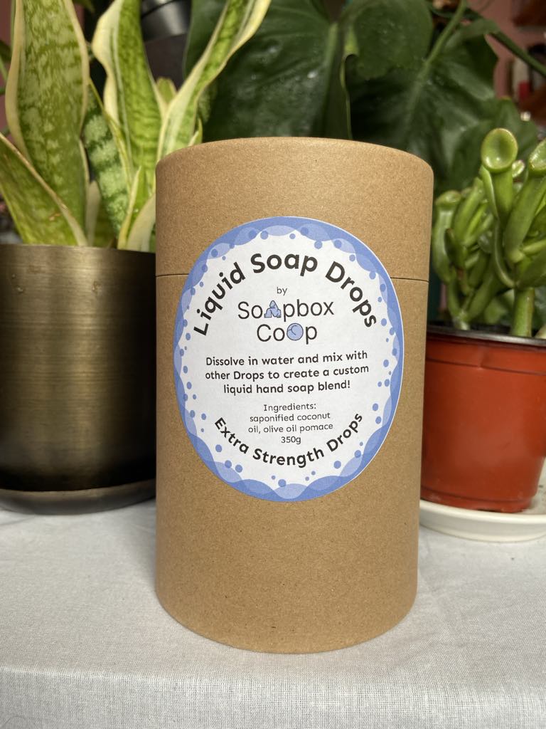 A brown container with a label on the front for our extra strength soap drops.