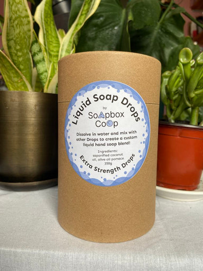 A brown container with a label on the front for our extra strength soap drops.